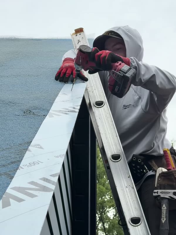 Working at the roof edge over the river